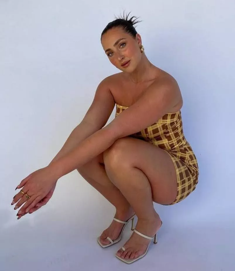 Brunette in patterned dress & heels