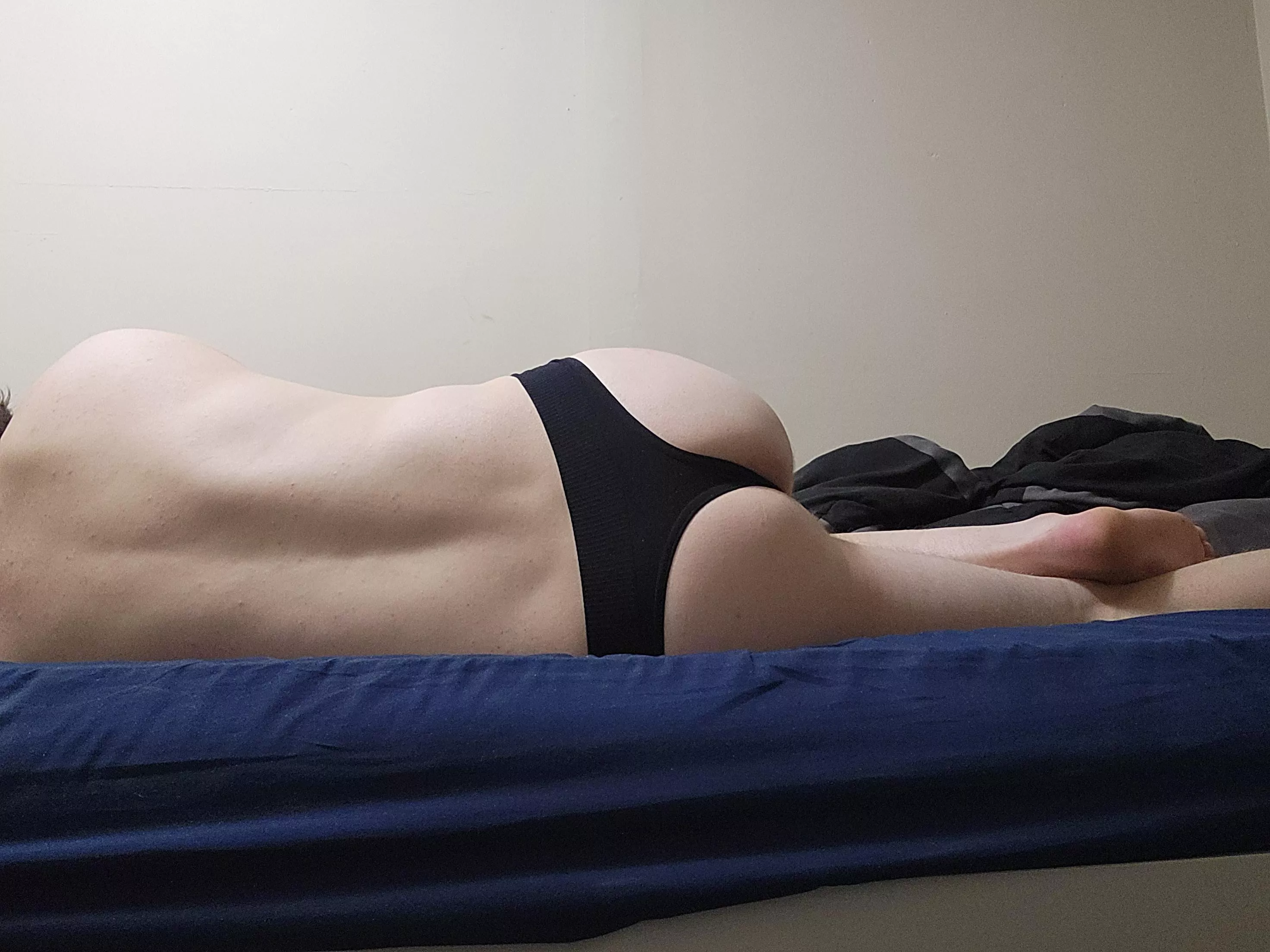 Black thong in bed