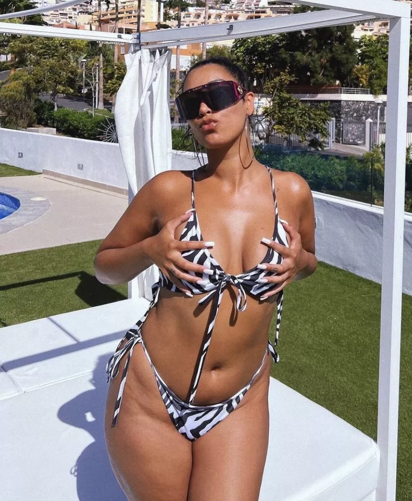 playing with her own boobs