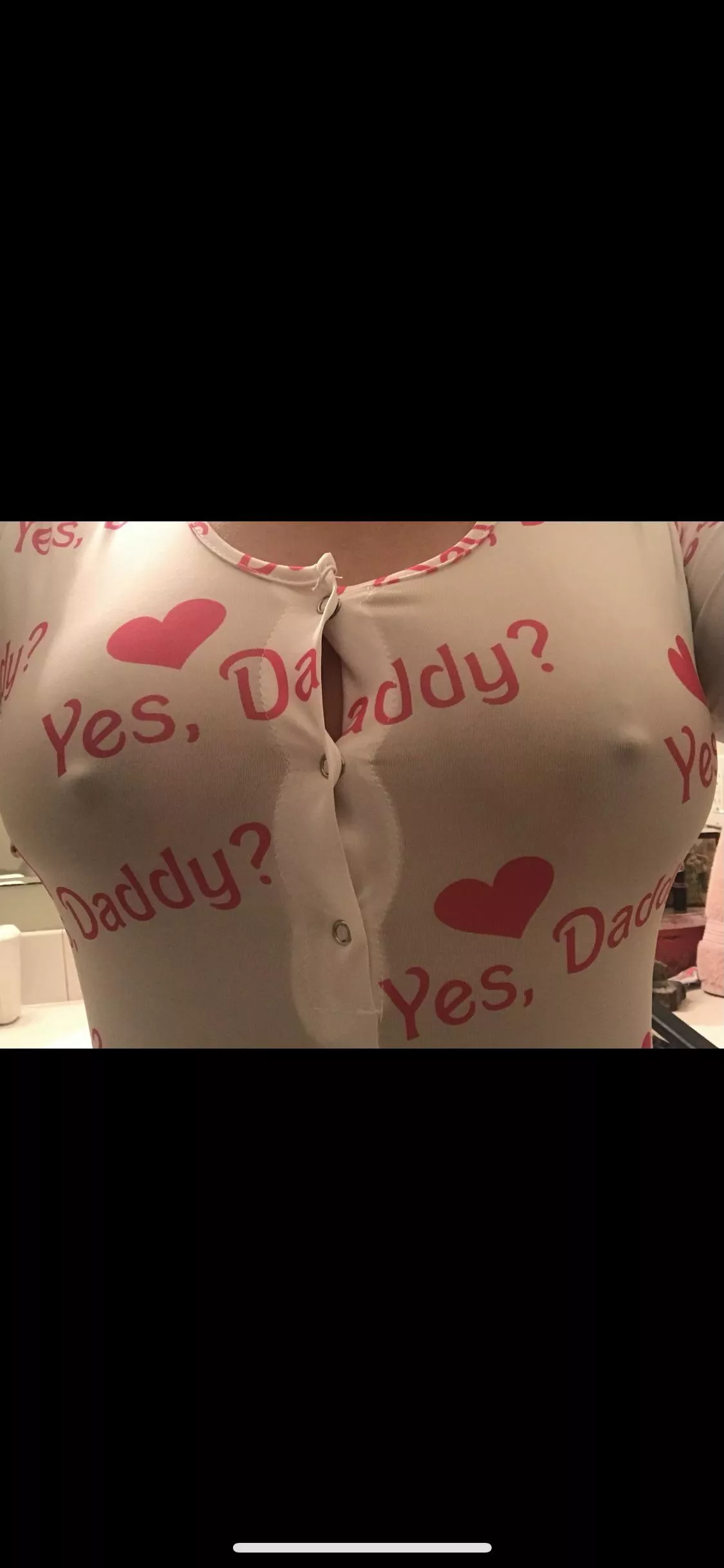 Trying on my daughters tank top. Fits a little snuggle.