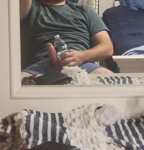 against a water bottle