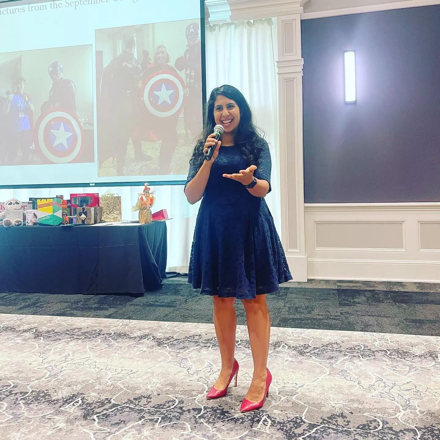 FL Rep. Anna Eskamani speaking at Share The Care, Inc’s Caregiver Appreciation Brunch in red heels