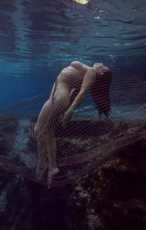 Got caught by a net while swimming naked