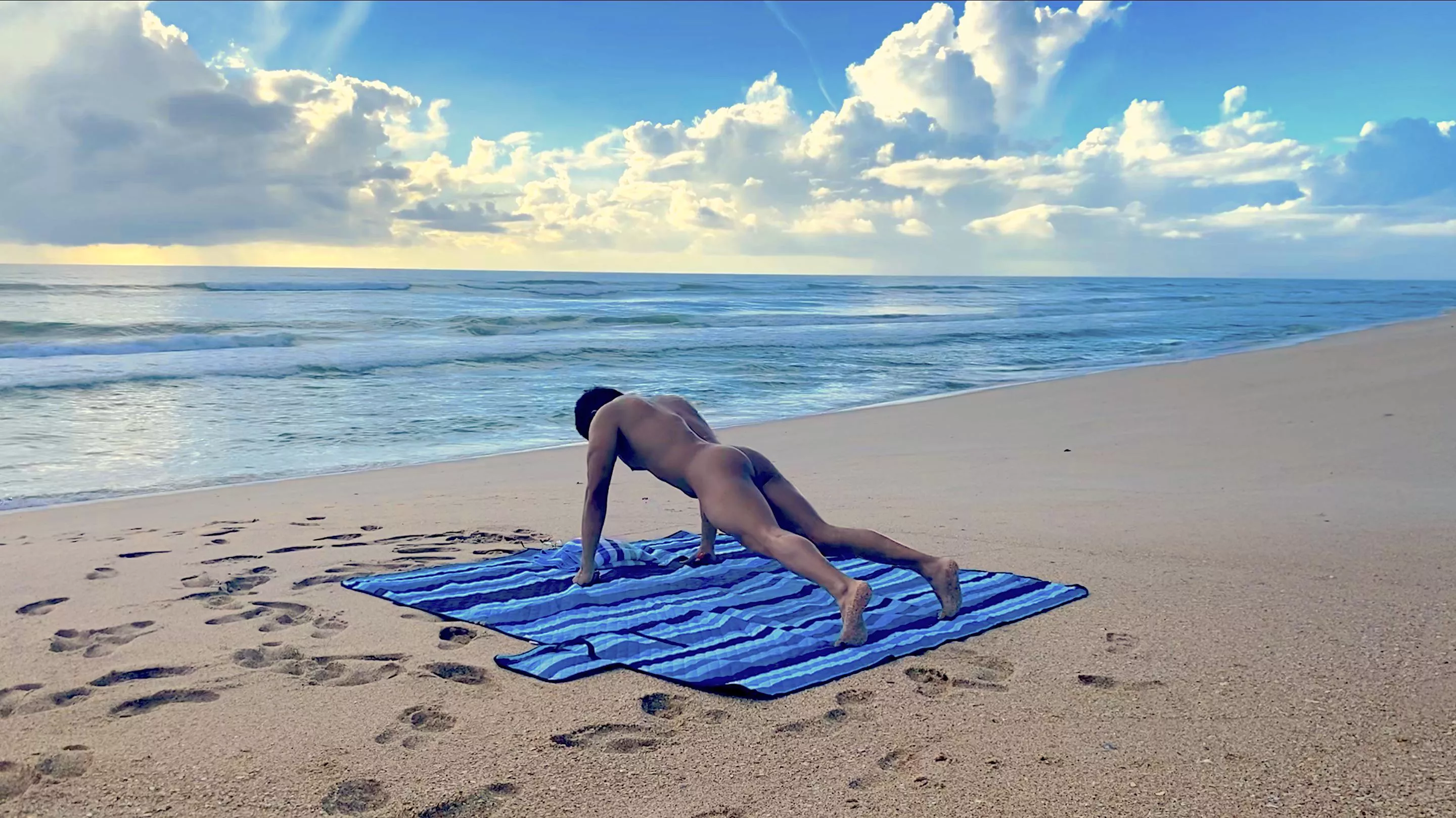 Naked yoga at the beach