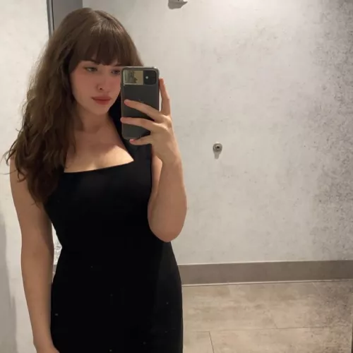 Bangs and a tight black dress
