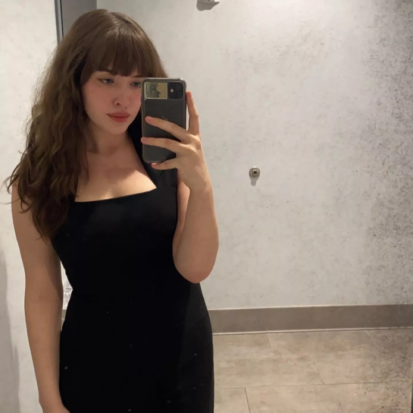 Bangs and a tight black dress