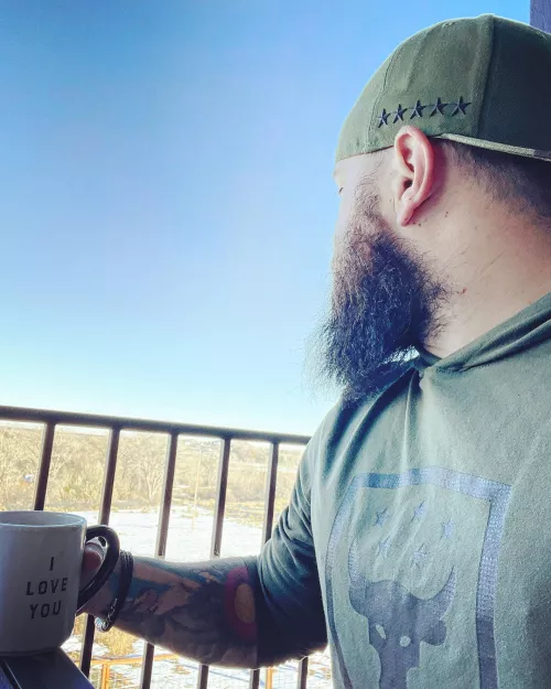 Beard, tattoos, coffee and a view