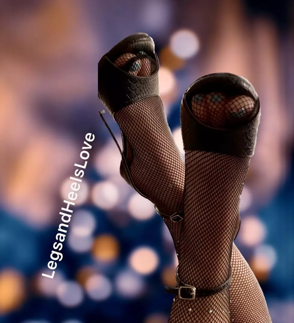 Close up view of sparkly fishnets and heels.