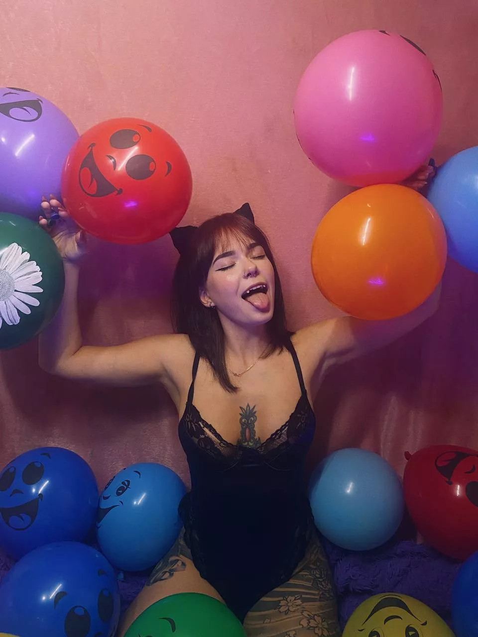 Little kitty playing with balloons
