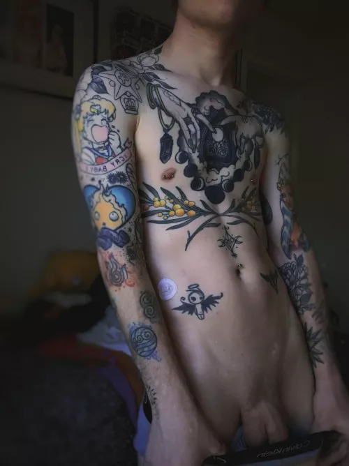 Skinny boy, plenty of tattoos