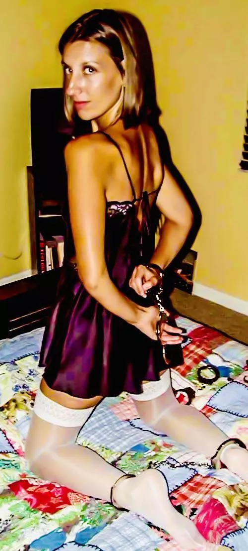 Wife in lingerie stockings and real handcuffs