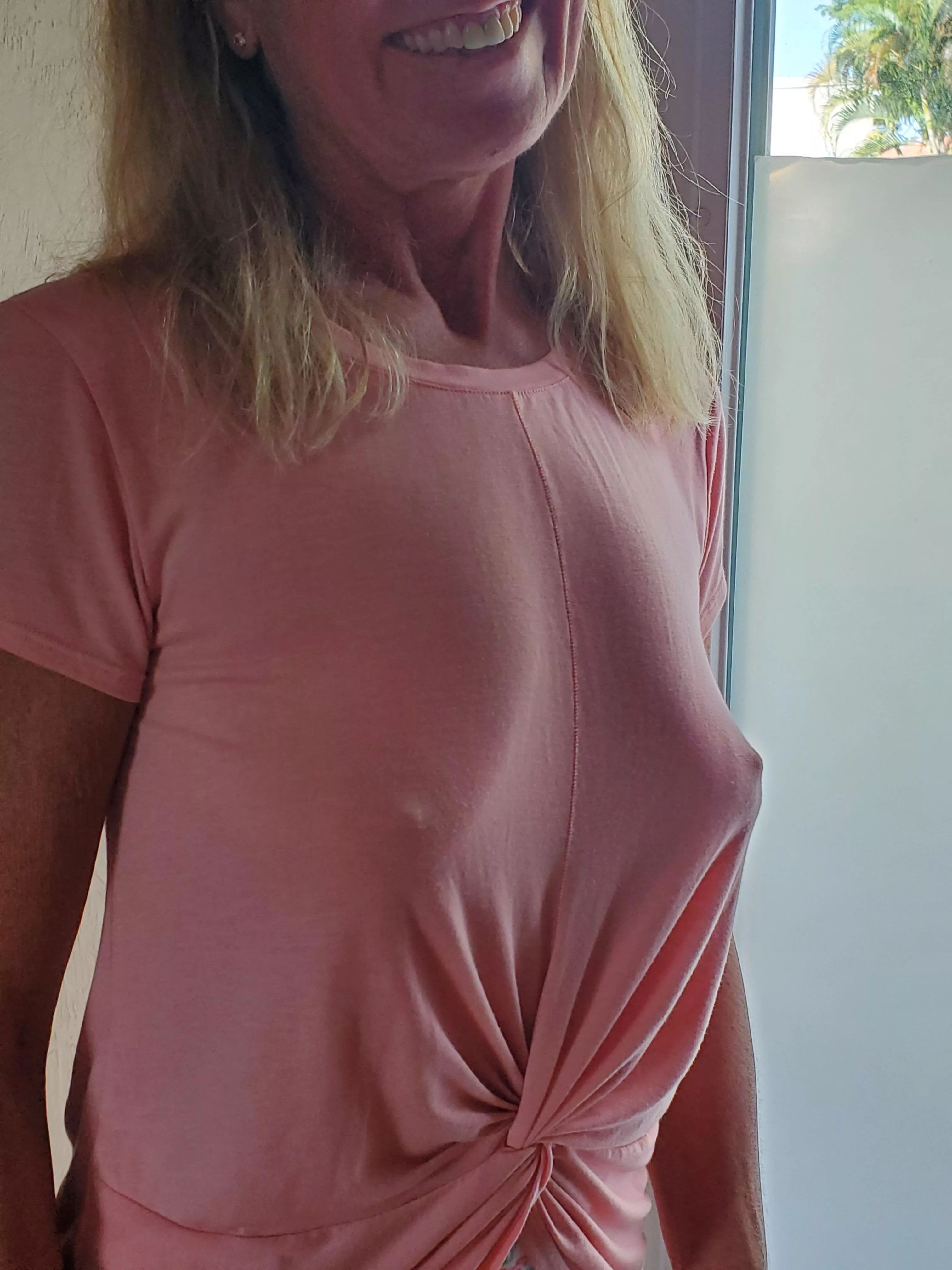 I love how this shirt drapes over her sexy tits.