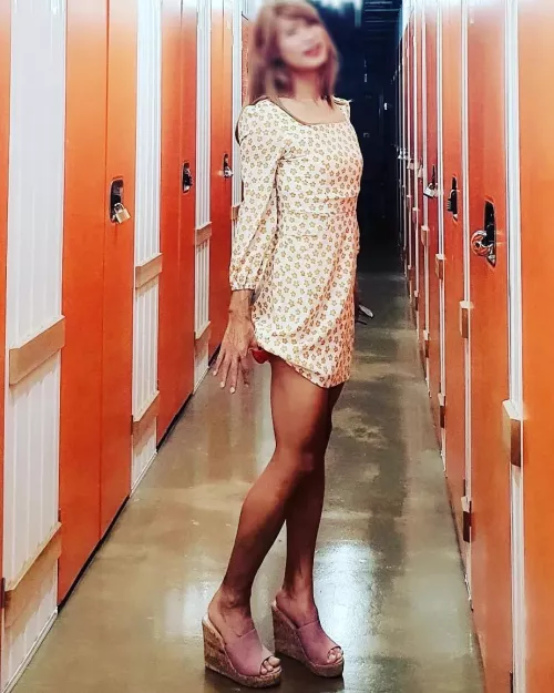 I'm wearing my wife's dress. I can wear although it's fitting, the sleeves short and the hemline short. I'm taking the dress over since she does not wear it anymore. She wore this a few times with super high heels while we were dating. I want to wear