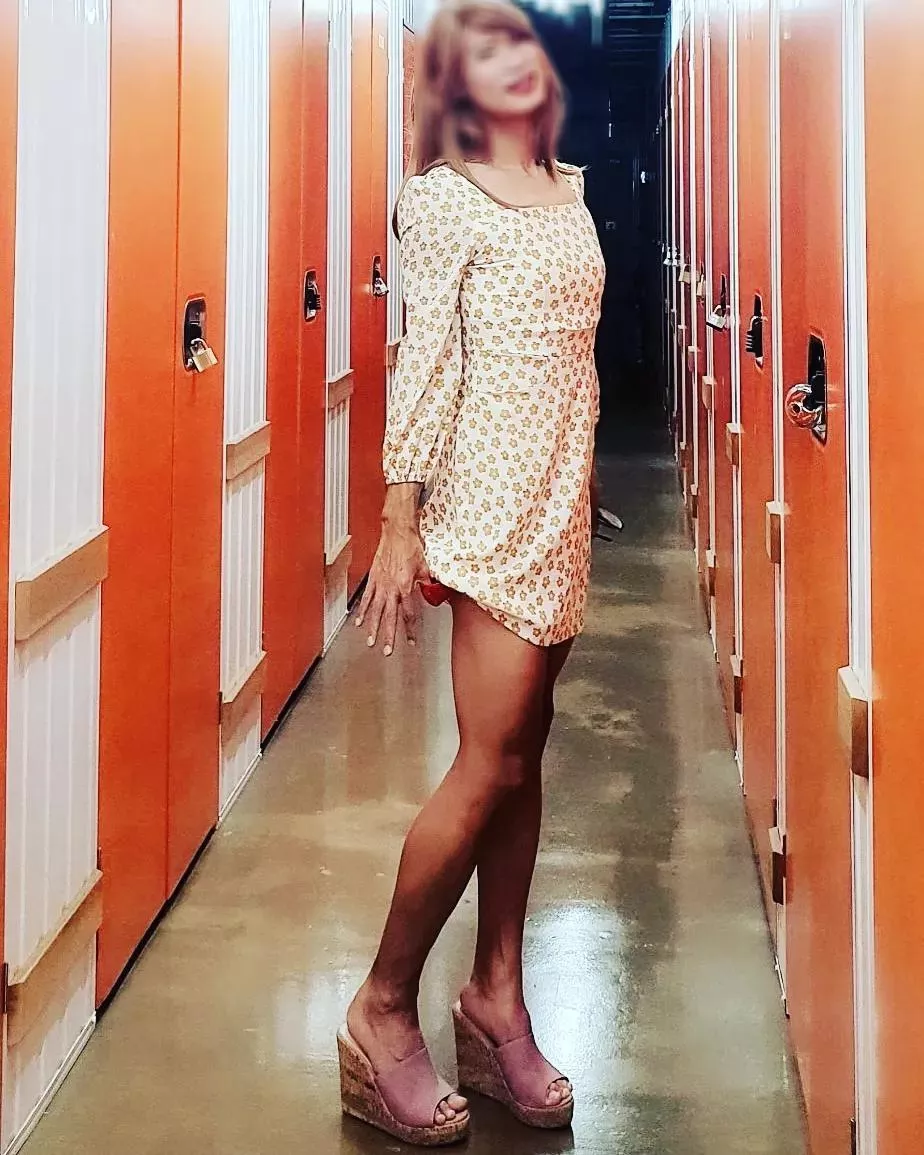 I'm wearing my wife's dress. I can wear although it's fitting, the sleeves short and the hemline short. I'm taking the dress over since she does not wear it anymore. She wore this a few times with super high heels while we were dating. I want to wear