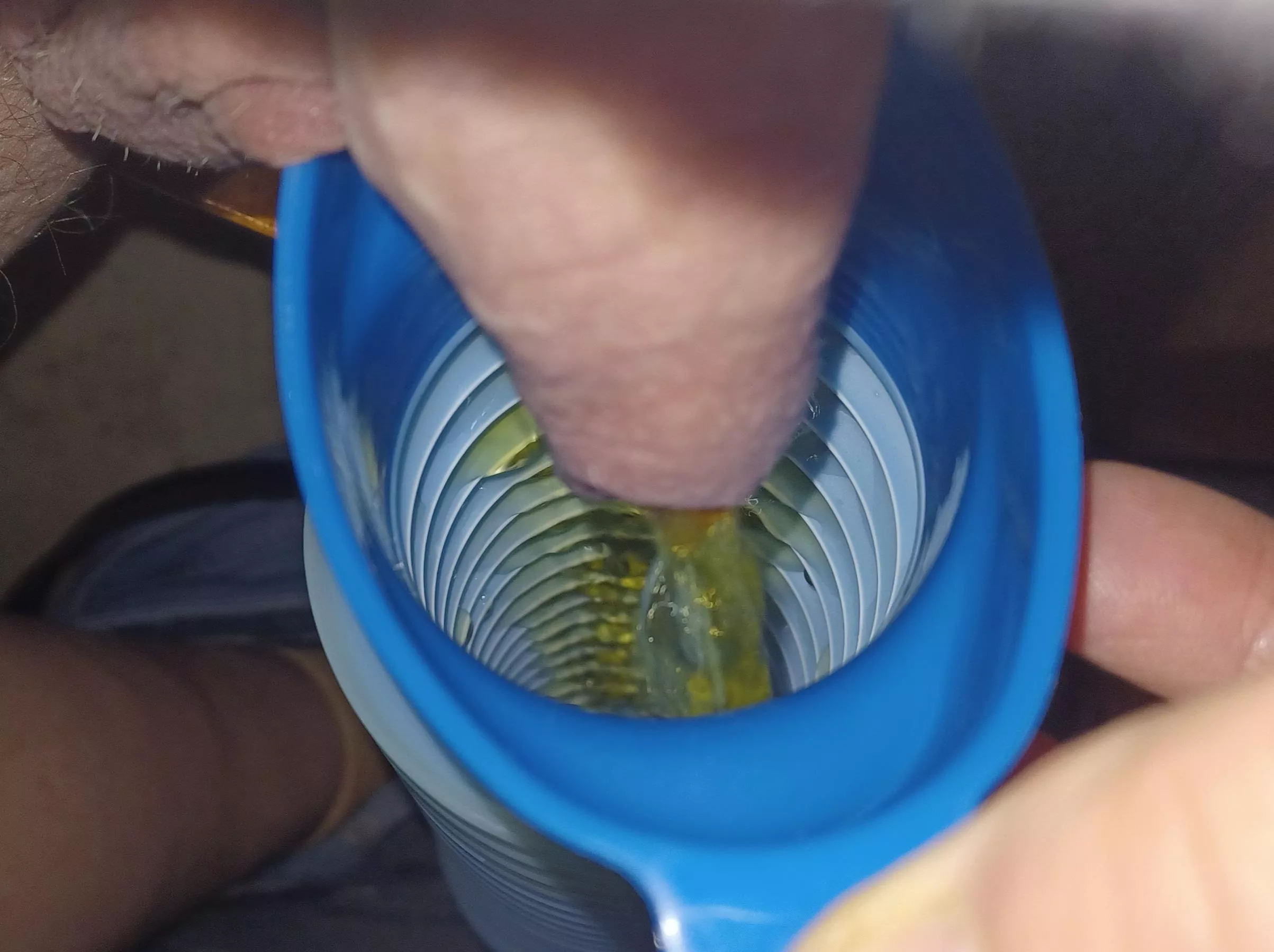 Sitting on a chair taking a piss