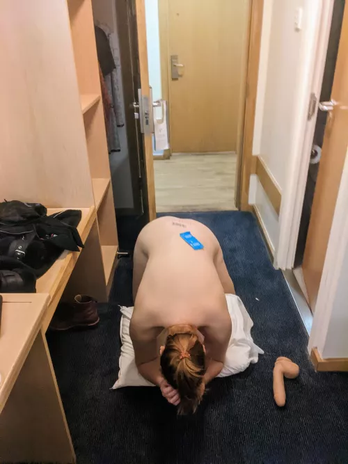 Posing in front of open hotel door (f)