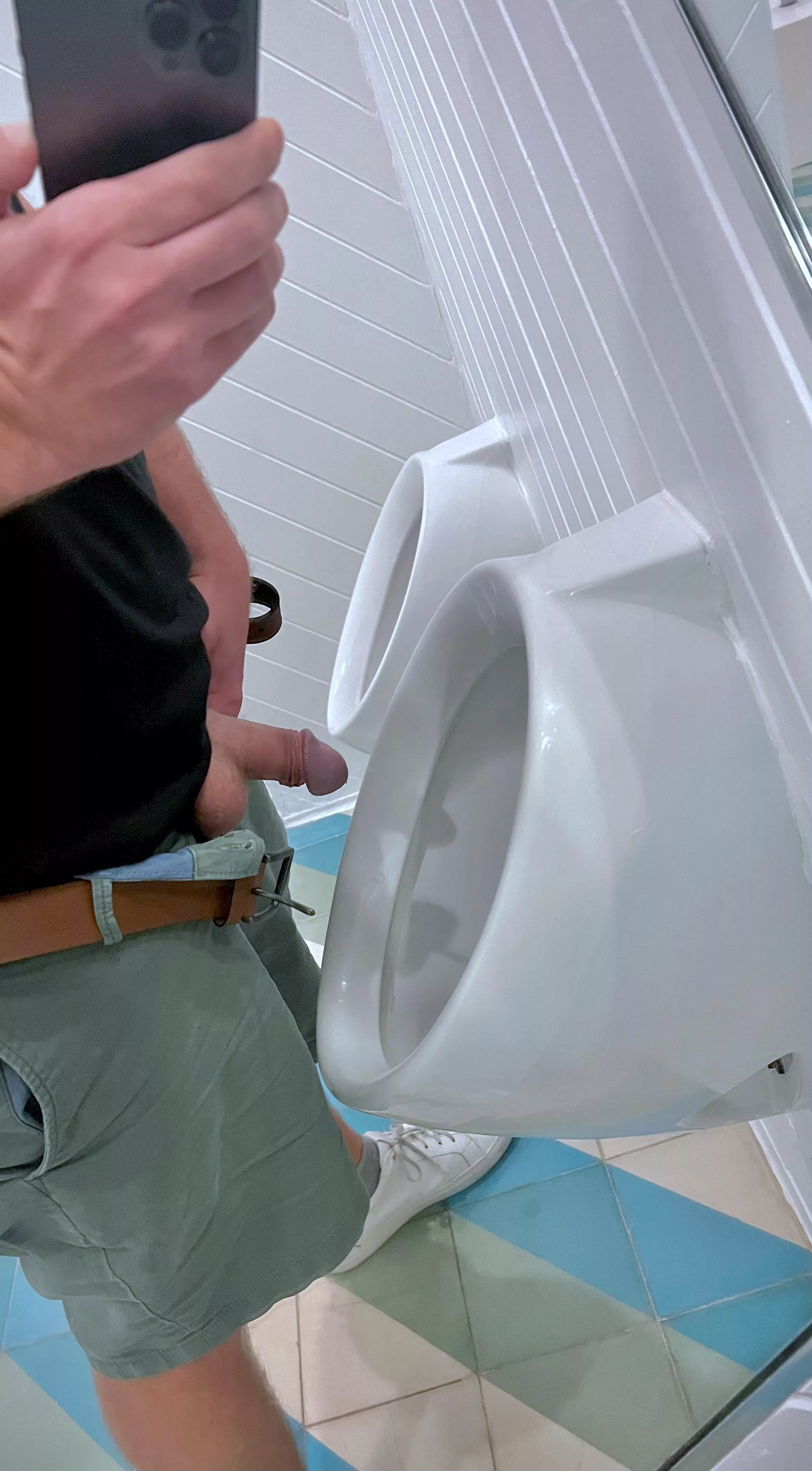 Mirror next to Urinals: bad design or pretty kinky?