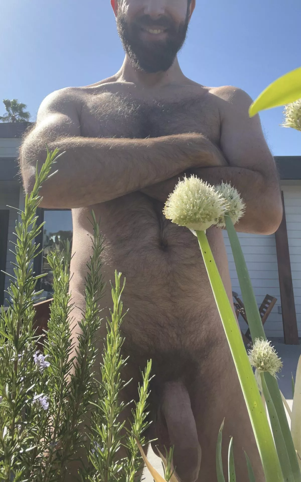 I love being nude in my garden. Do you mind if I let my dick out?