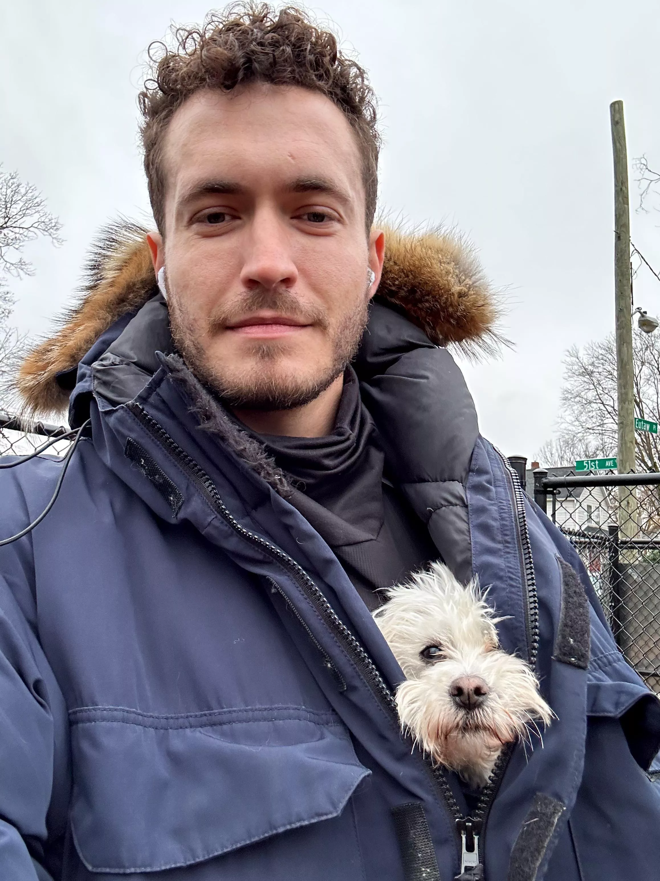 Big coat cuddling with a Coton Detulear!