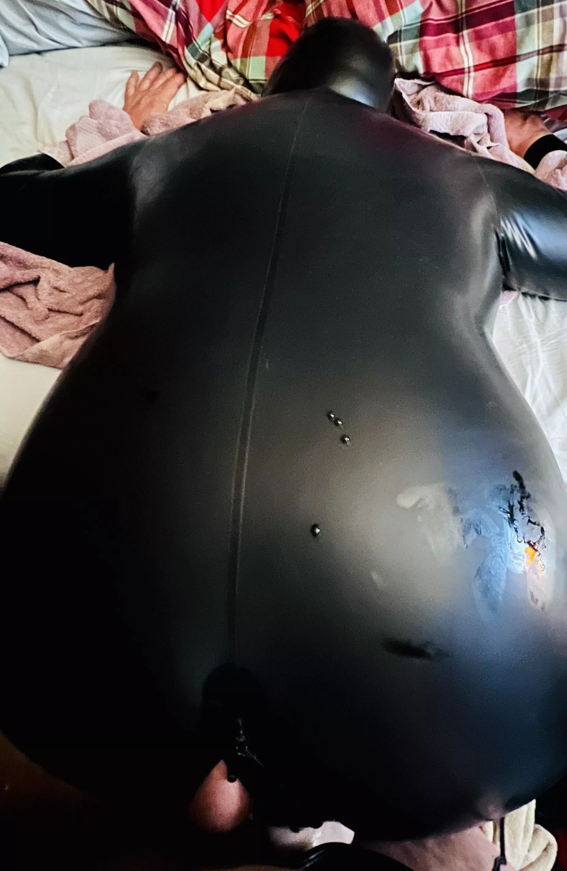 Getting absolutely filled last night by my wife while in my rubber suit. New larger silicone dildo. Where have you been all my life?
