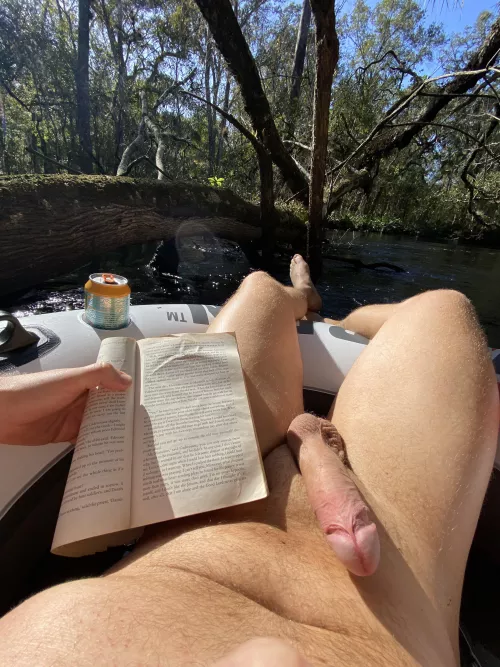 A good book at the river is made better without clothes