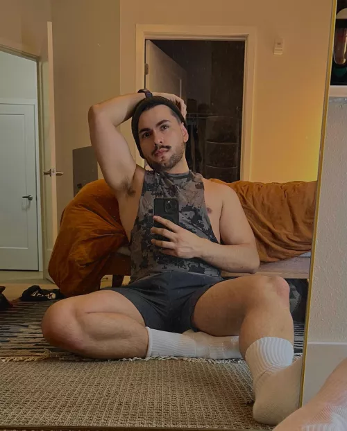 ignoring the pile of laundry off camera