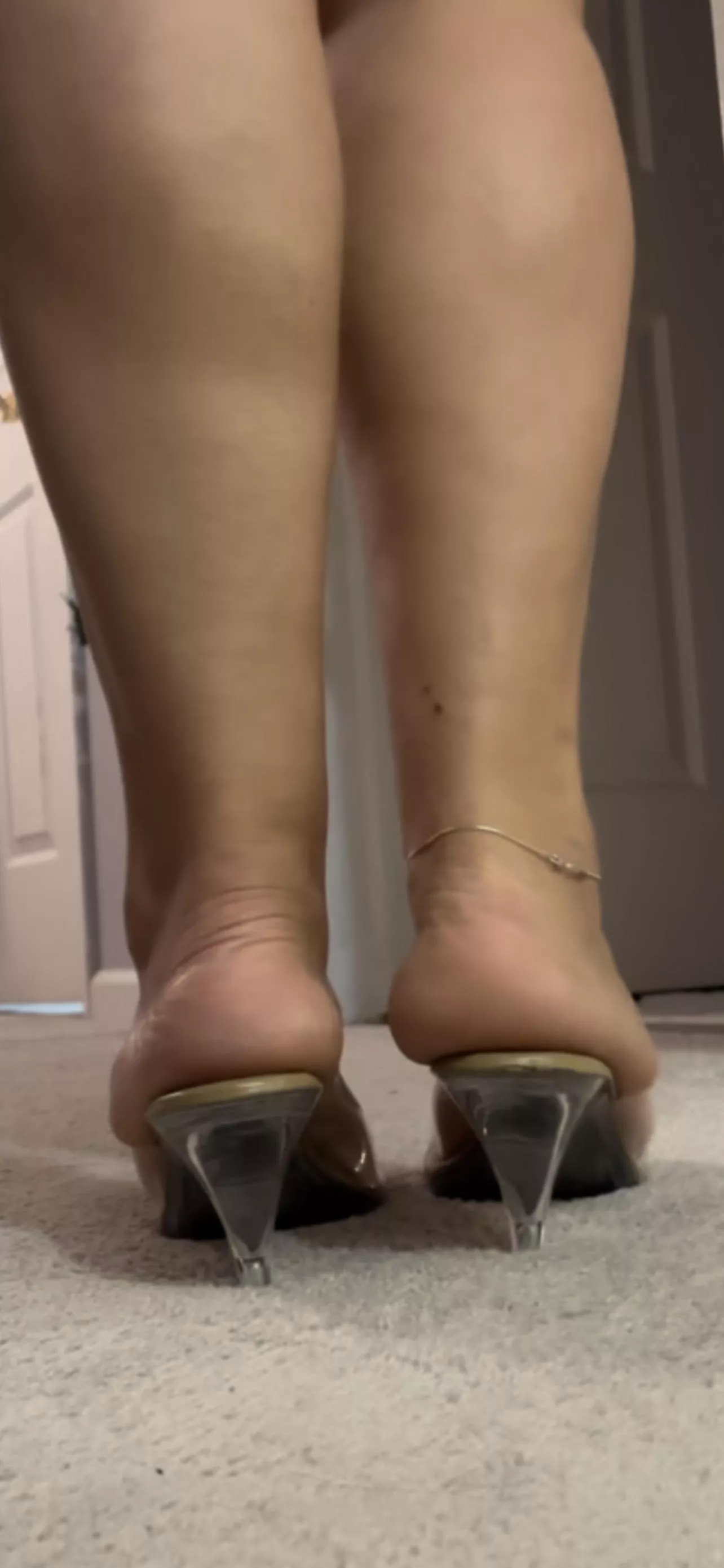 My gf's massive feet and heels spilling over her nude/clear heels (try to guess the size)
