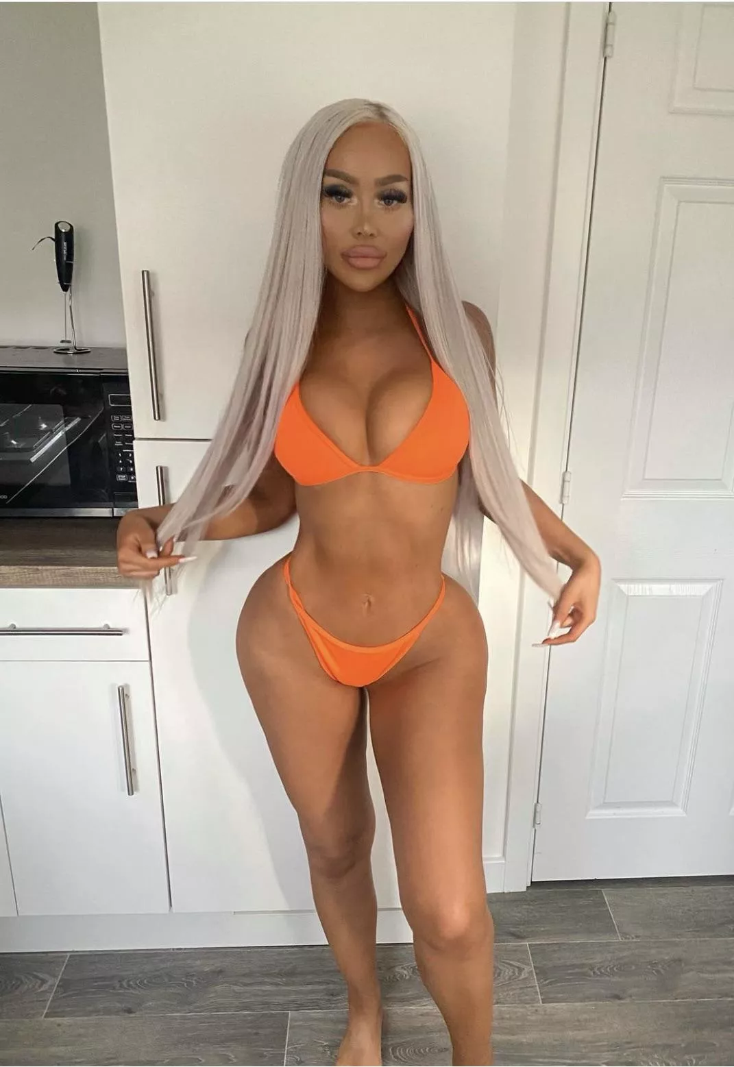 Surgically enhanced doll