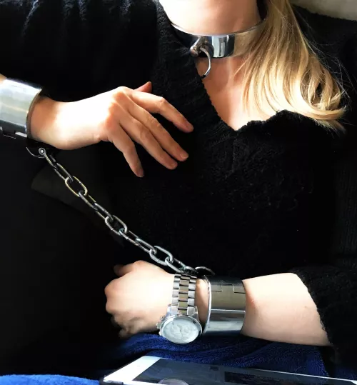 An elegant steel collar - and heavy shackles