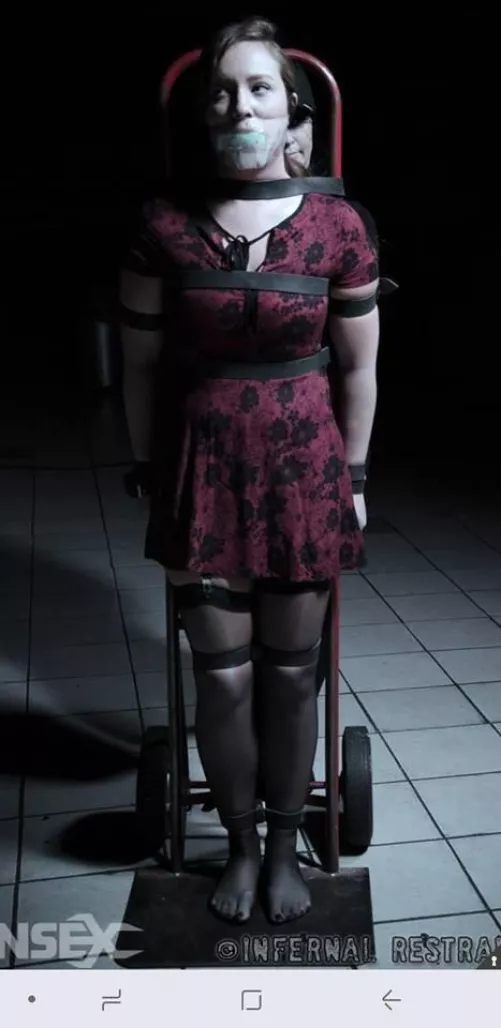 Helpless cutie being carted in