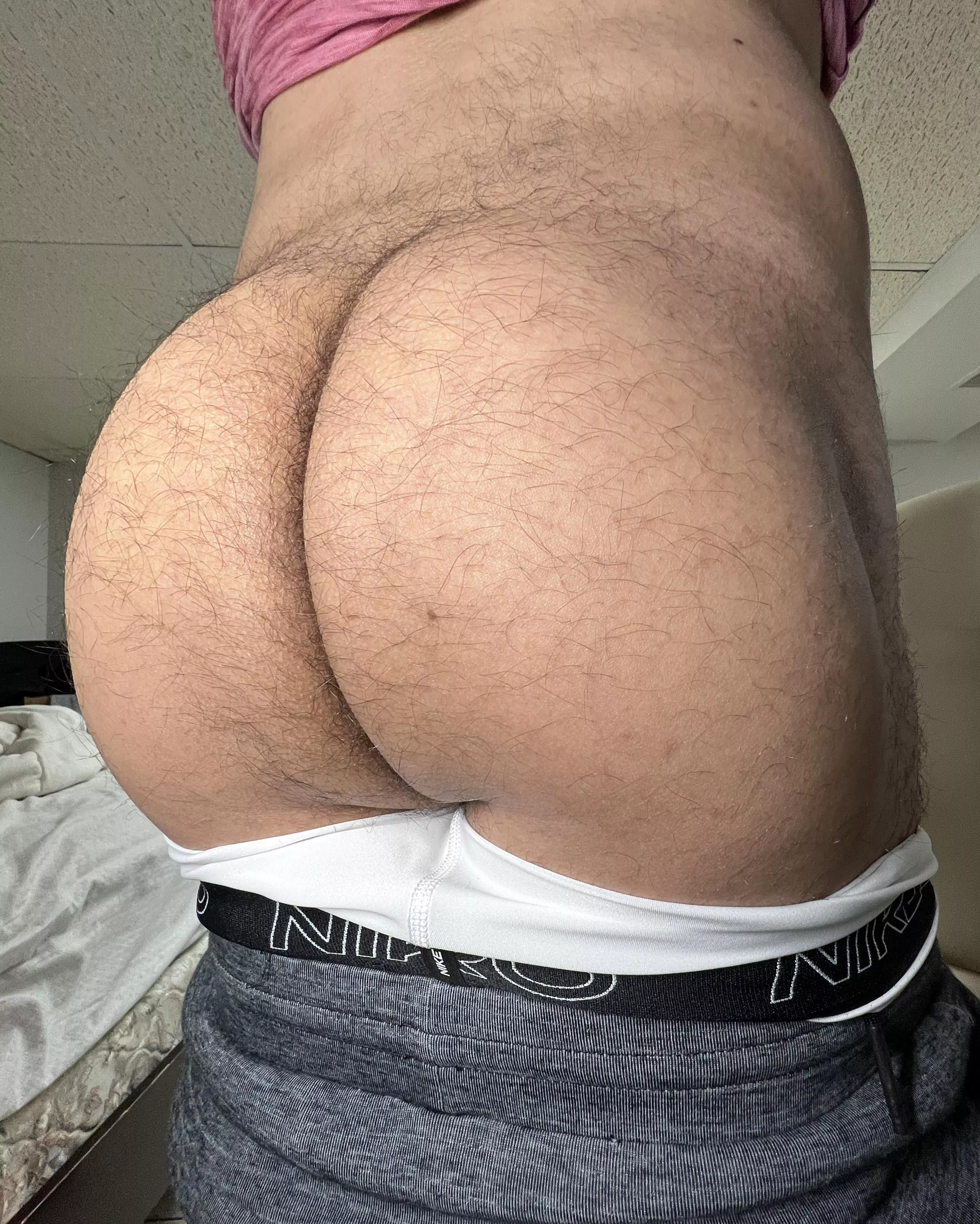 Take a deep breath in and hold it to maintain proper core pressure during heavy squats.