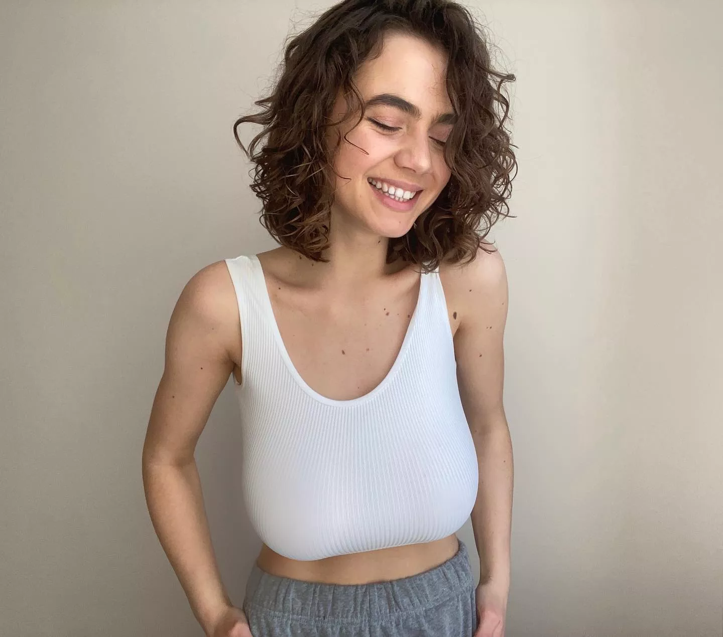 Happy in a white top