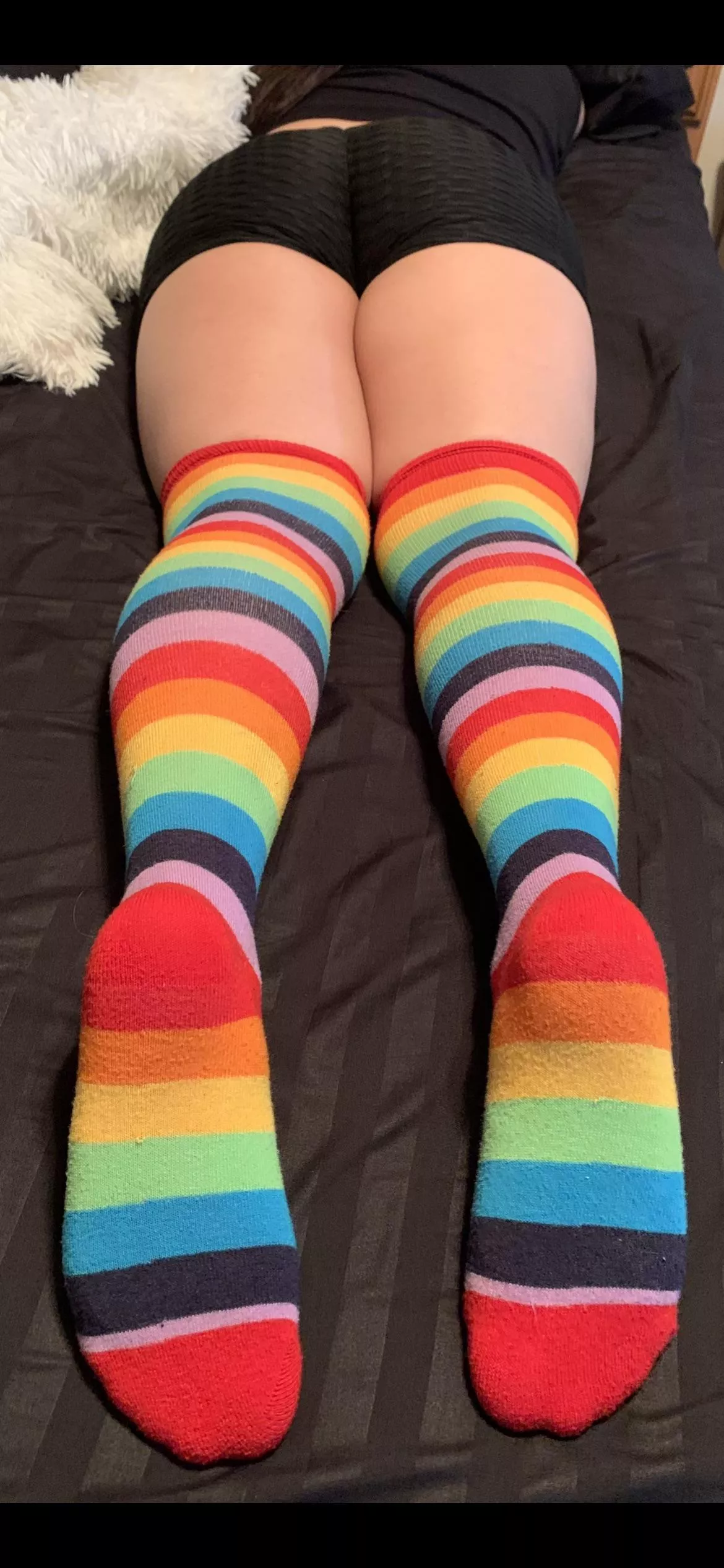 Little Latina wearing rainbow 🌈 thigh highs.