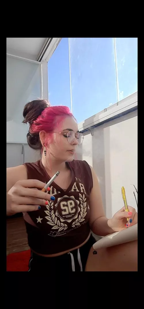 School girl having a smoke while studying😘