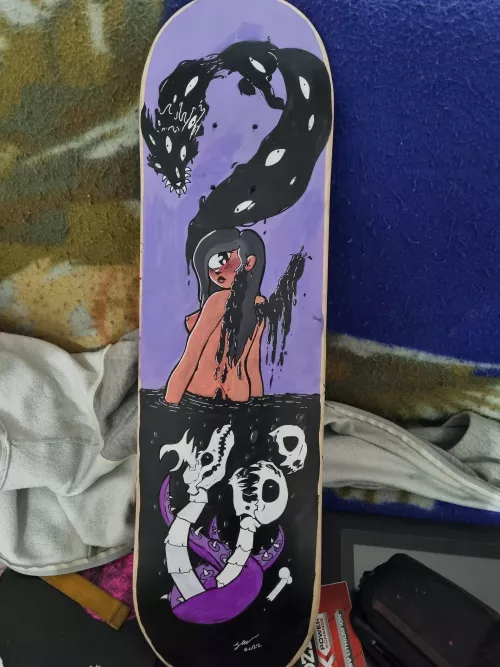 a scateboard deck that i just finnished painting