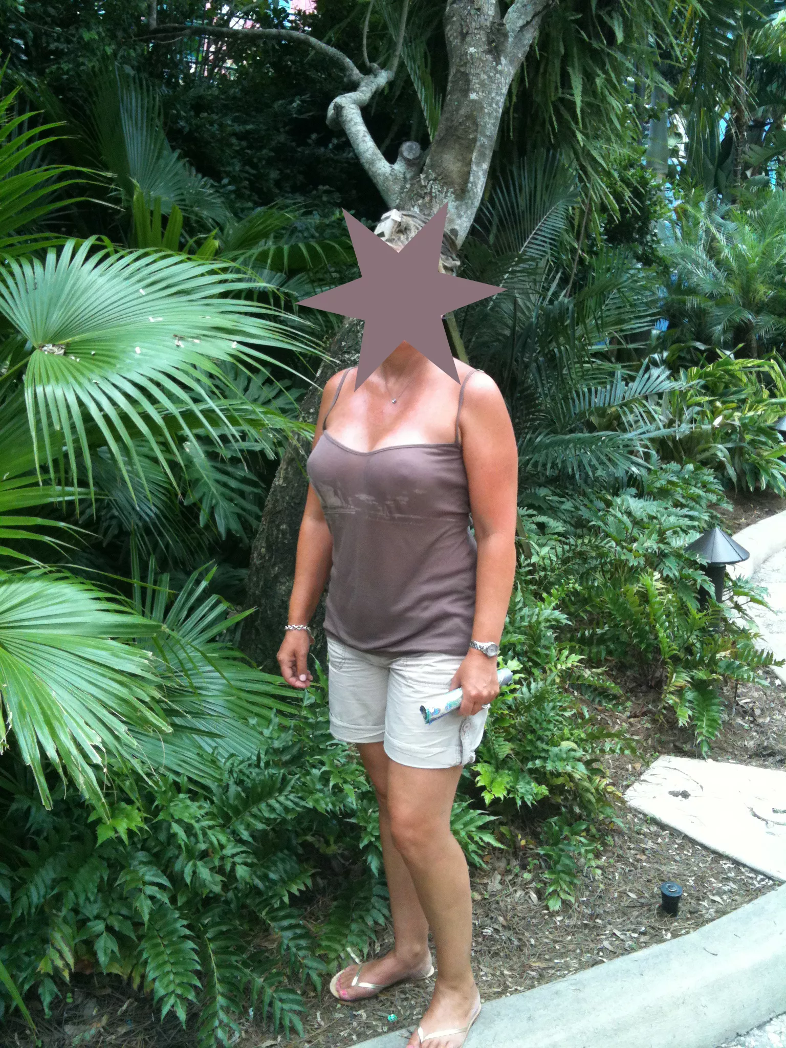 Teasing at Sea World in another braless top.