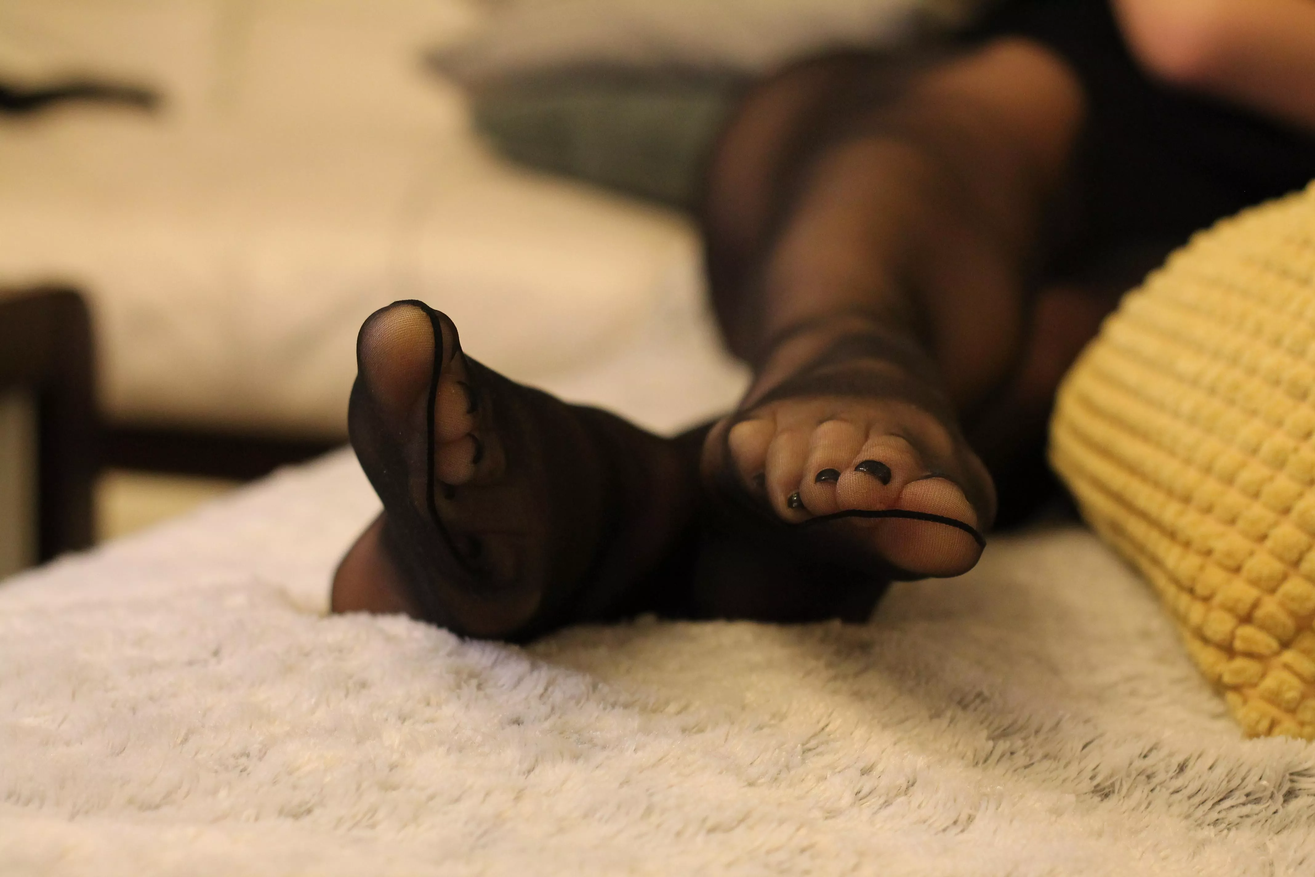 Black pedicure looks nice in pantyhose