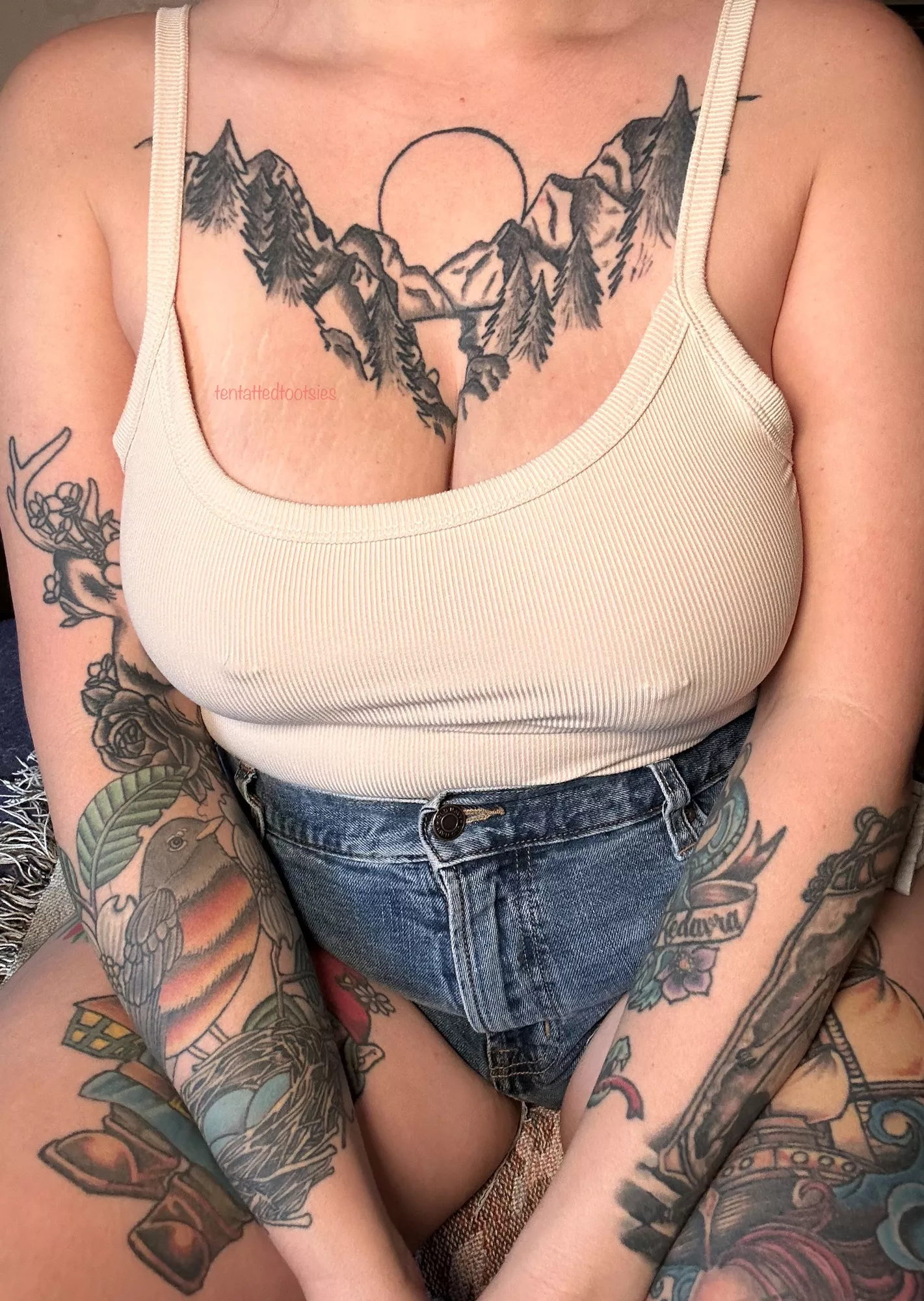 blue jeans and a tank top