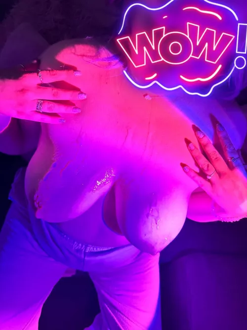 Covered in cum and bathed in neon light by the fire