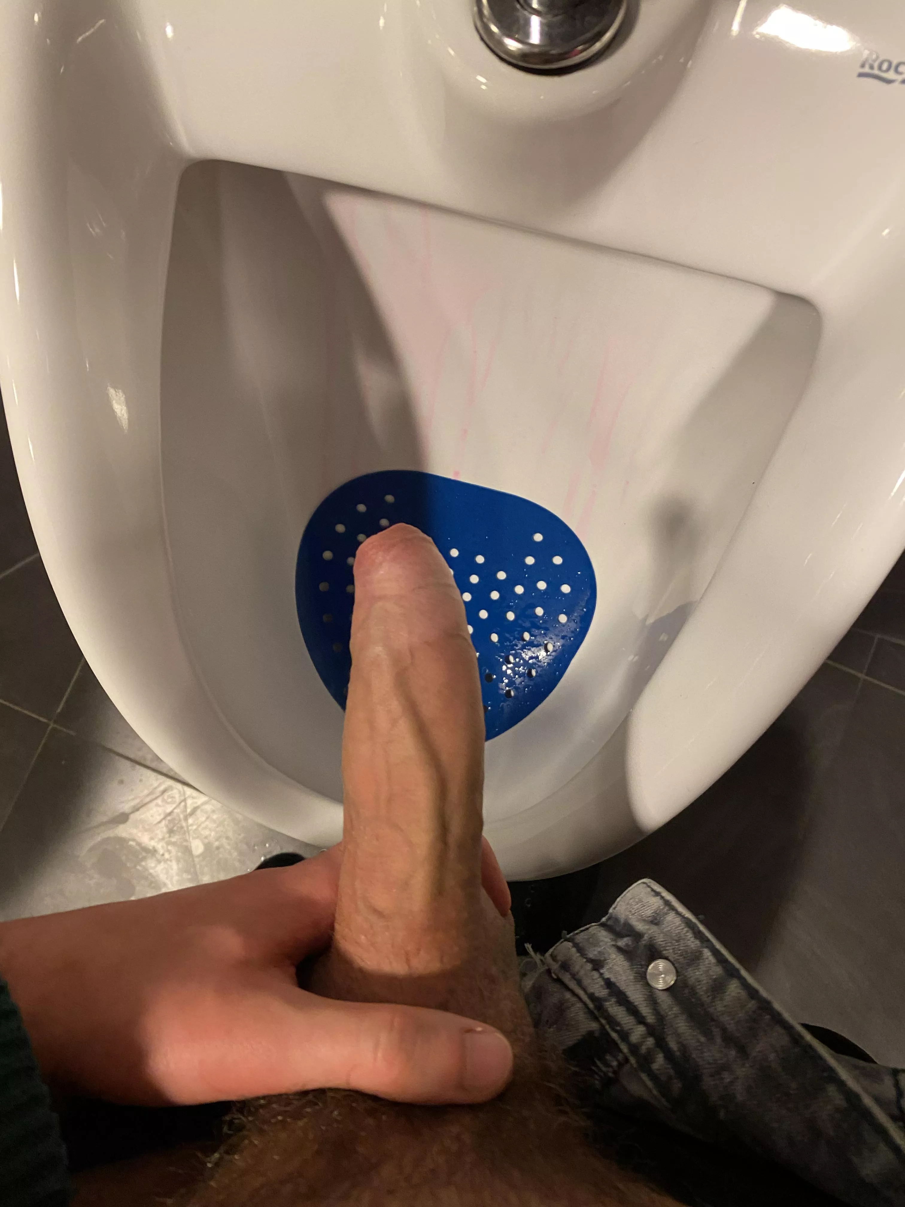 Pulling my hard dick at the urinals at my college while dudes were watching