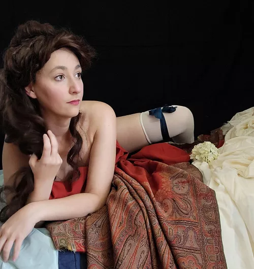 A lady, her shawl, and little else.