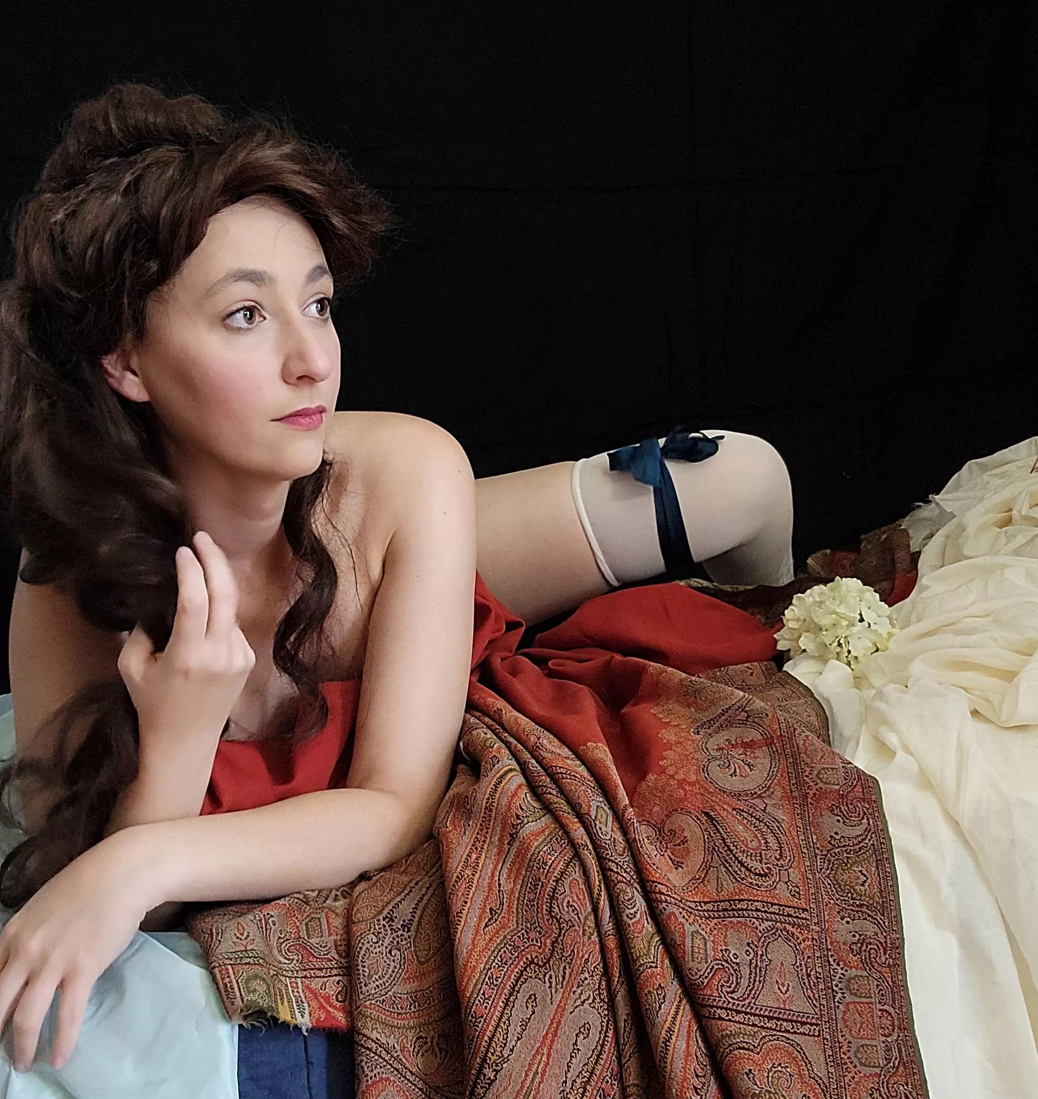 A lady, her shawl, and little else.