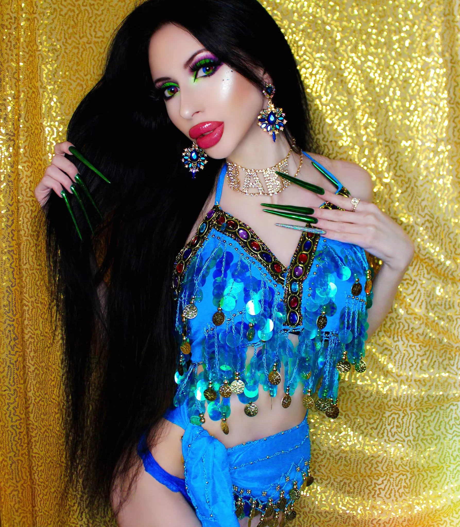 Bright makeup and long green nails