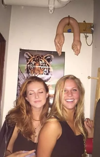 College girls posing with their trophy