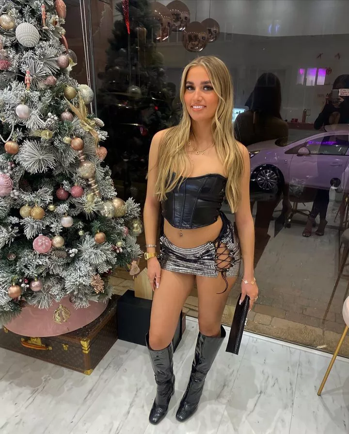 Emily in leather and tiny skirt