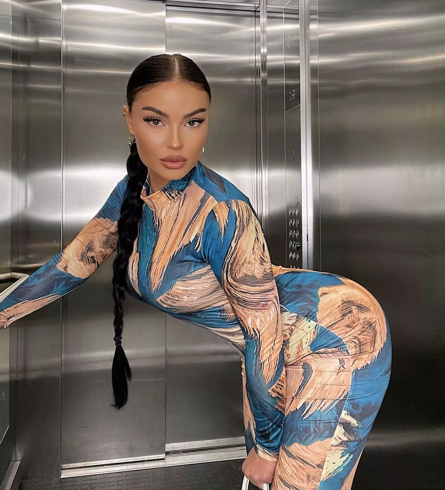 Striking a pose in the elevator