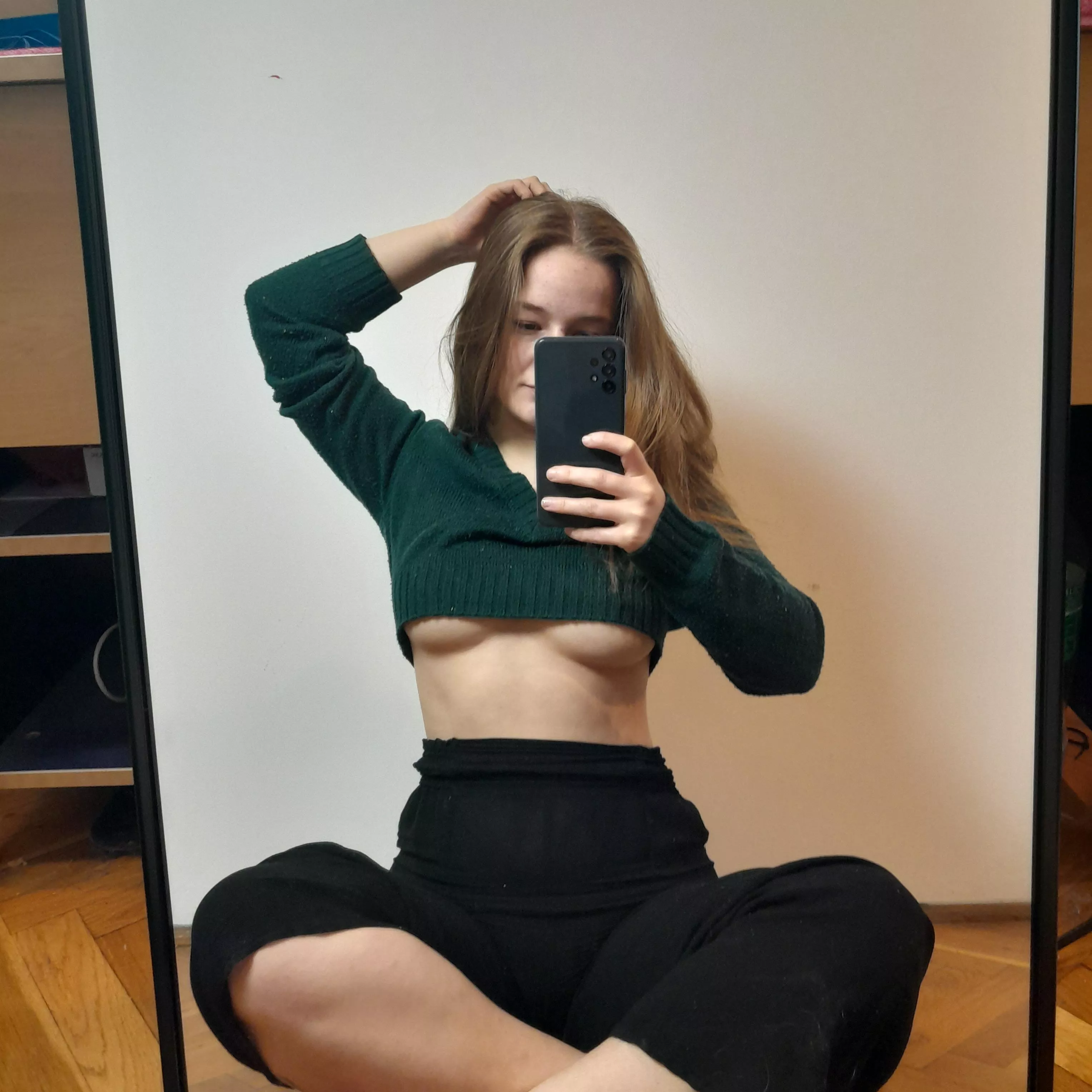 The sweater might be a little short