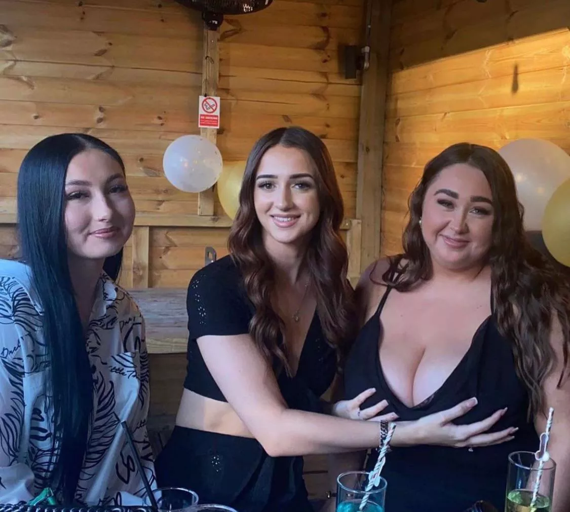 Helping support her breasts