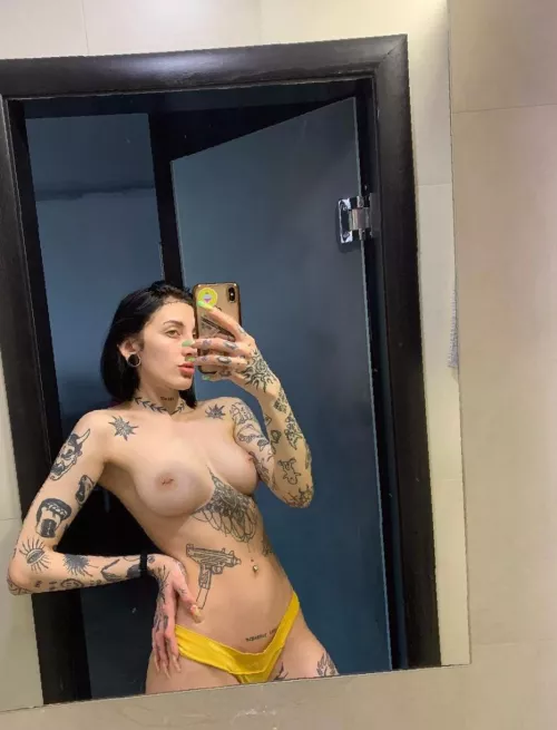 Showing off amazing breasts