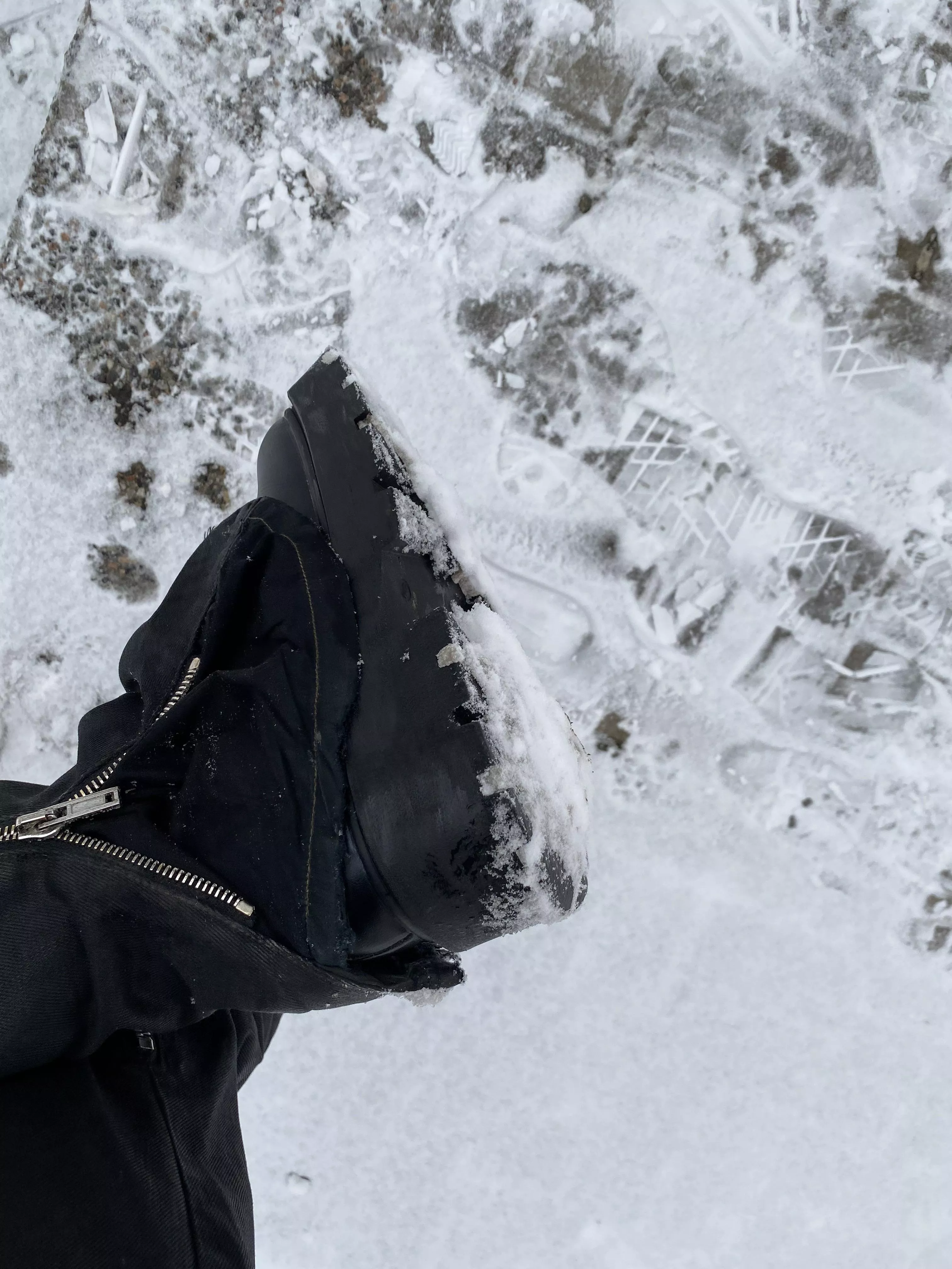 Snow building up under boots